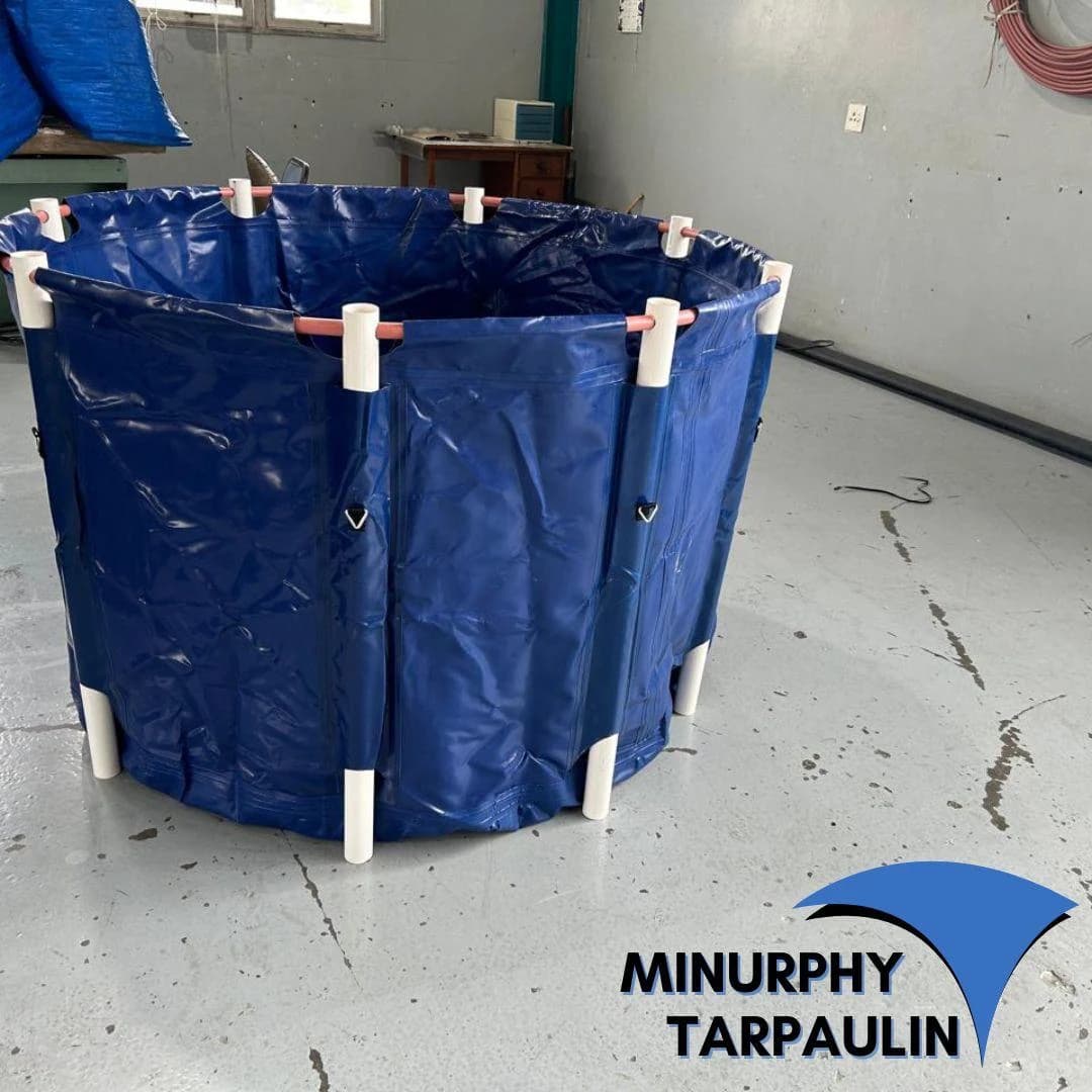Round blue PVC koi vat with reinforced corner pipes, ready in the Minurphy factory